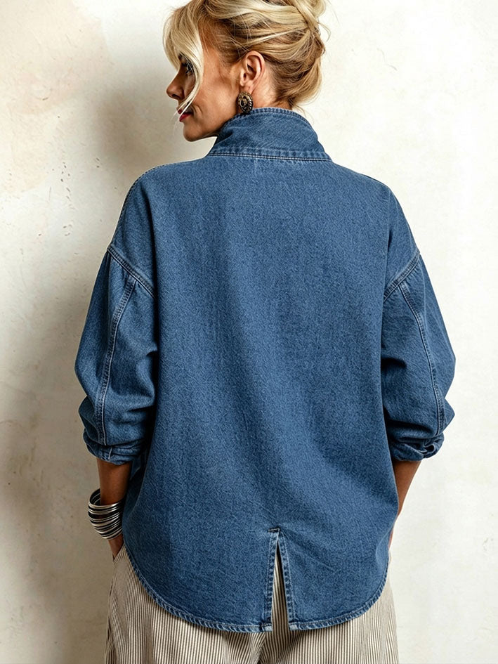 Back view showing the dropped shoulders and split curved hem