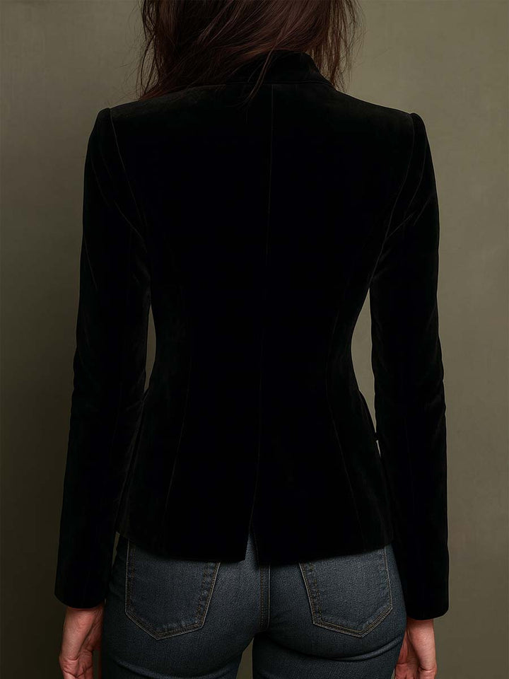 Back view of the black velvet-look fitted blazer