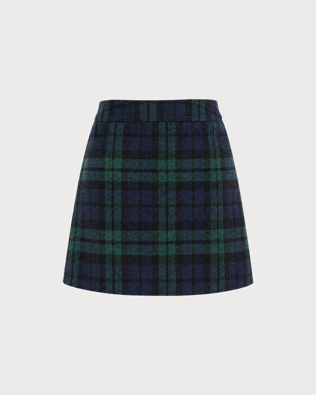 Flat lay of a green and navy plaid A-line mini skirt with elastic waist