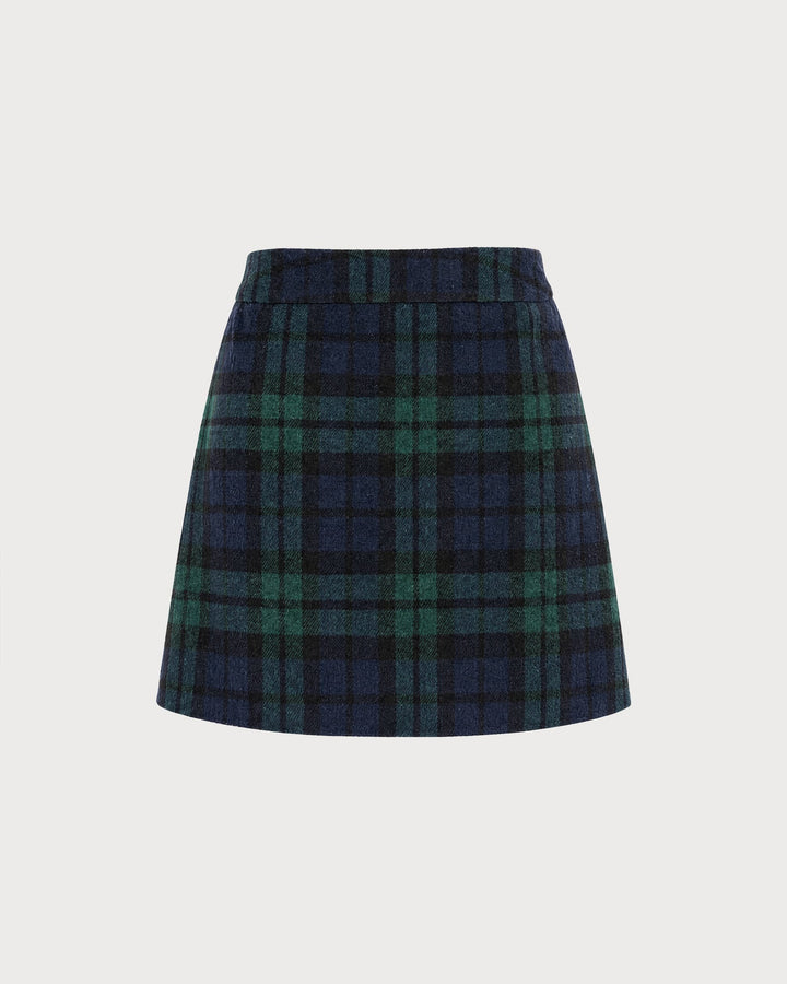 Flat lay of a green and navy plaid A-line mini skirt with elastic waist