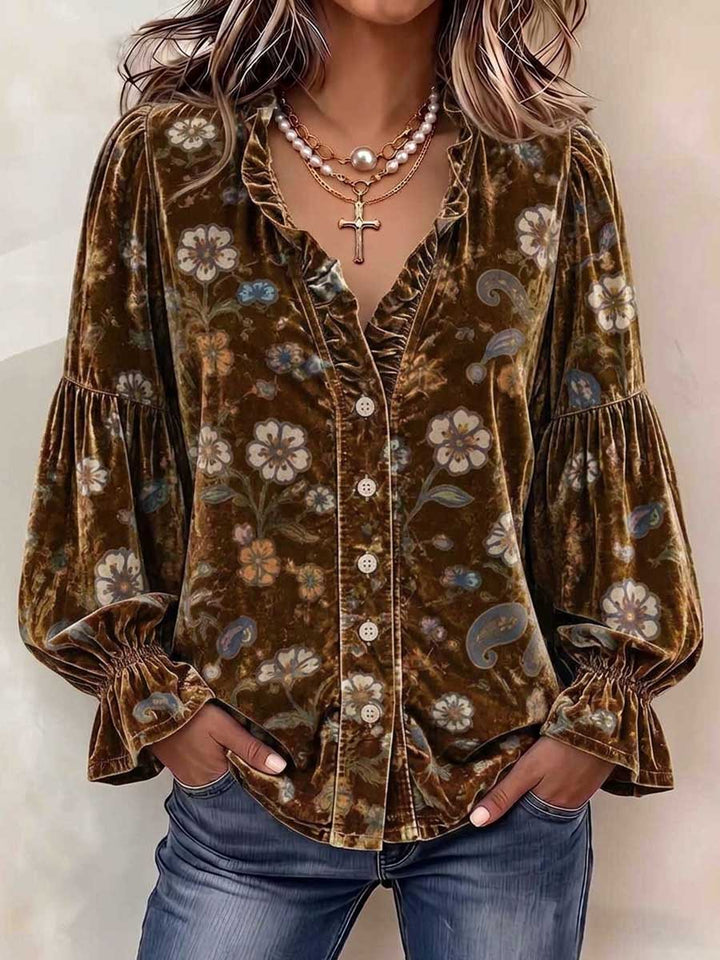 Brown floral blouse with pale buttons and shirred flared cuffs
