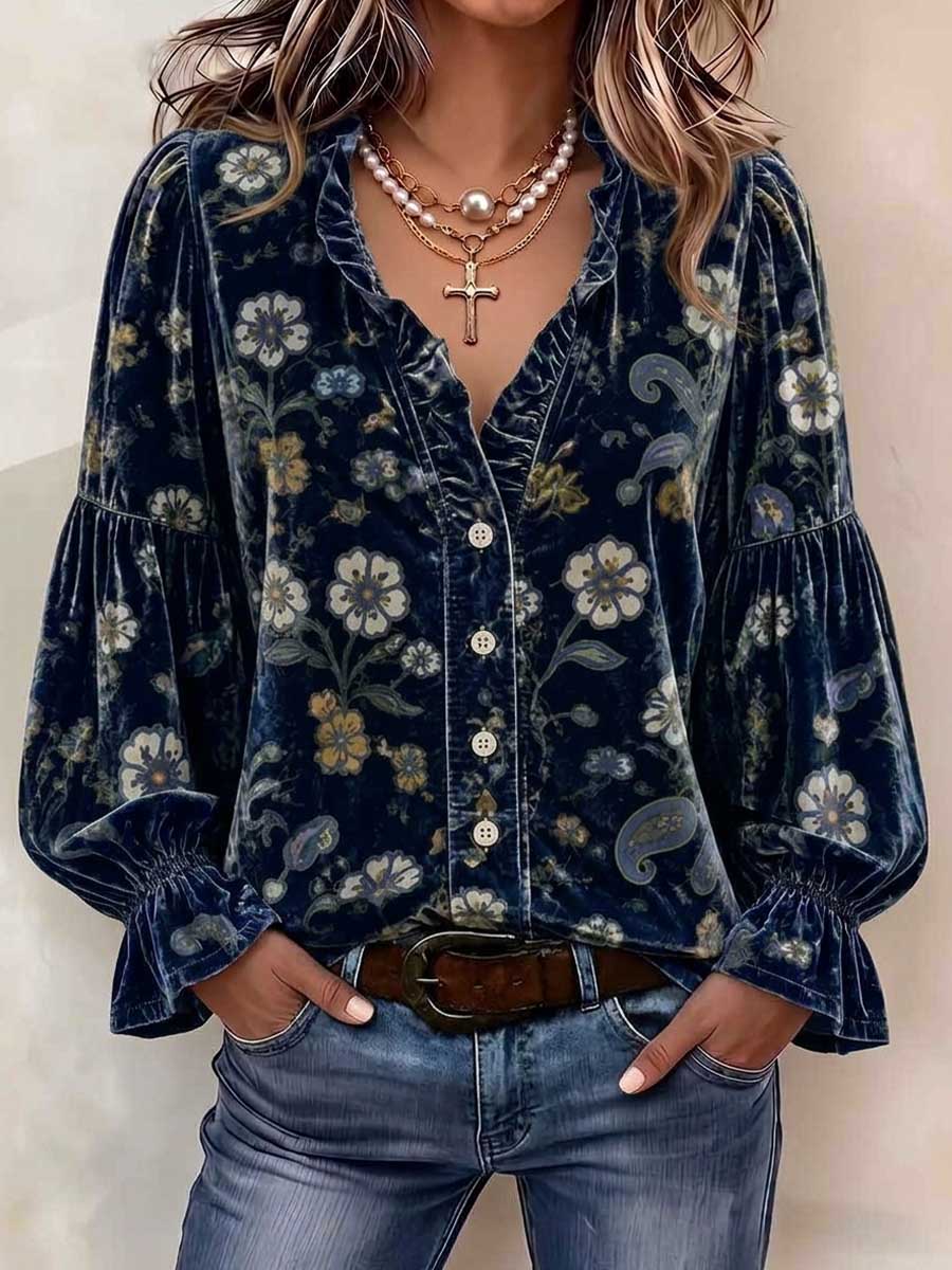 Navy floral blouse styled with a belt and a layered necklace
