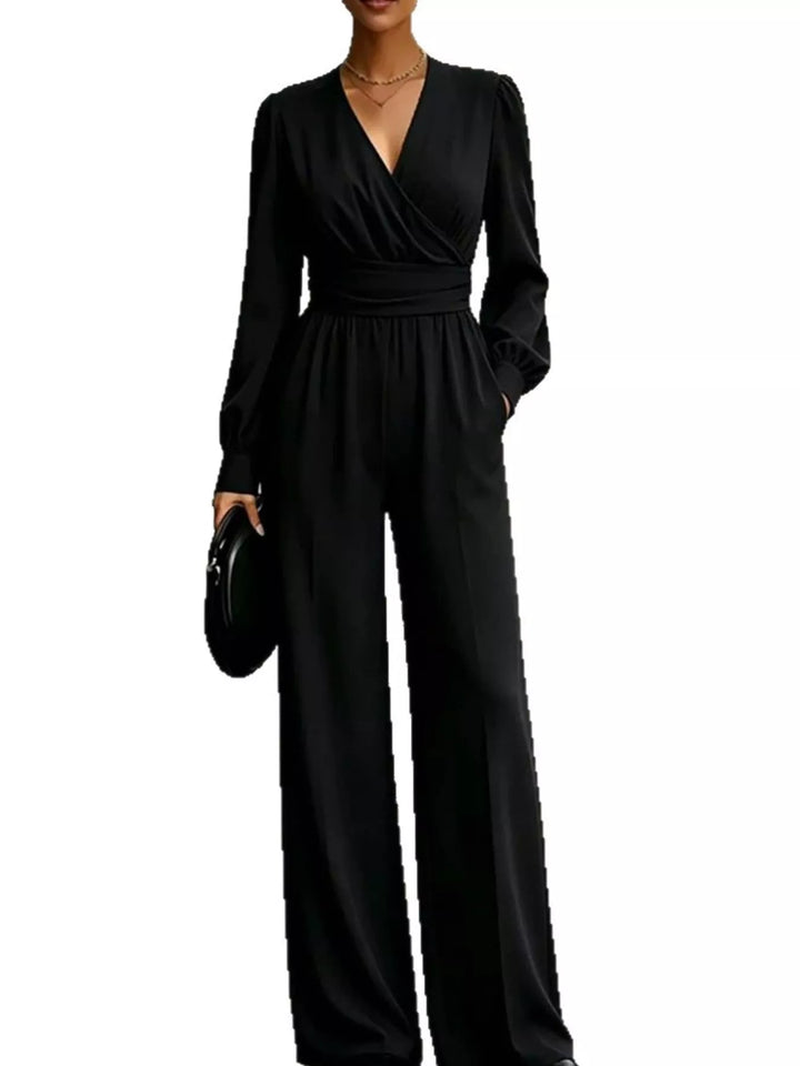 Black long sleeve jumpsuit with wide legs on a white background