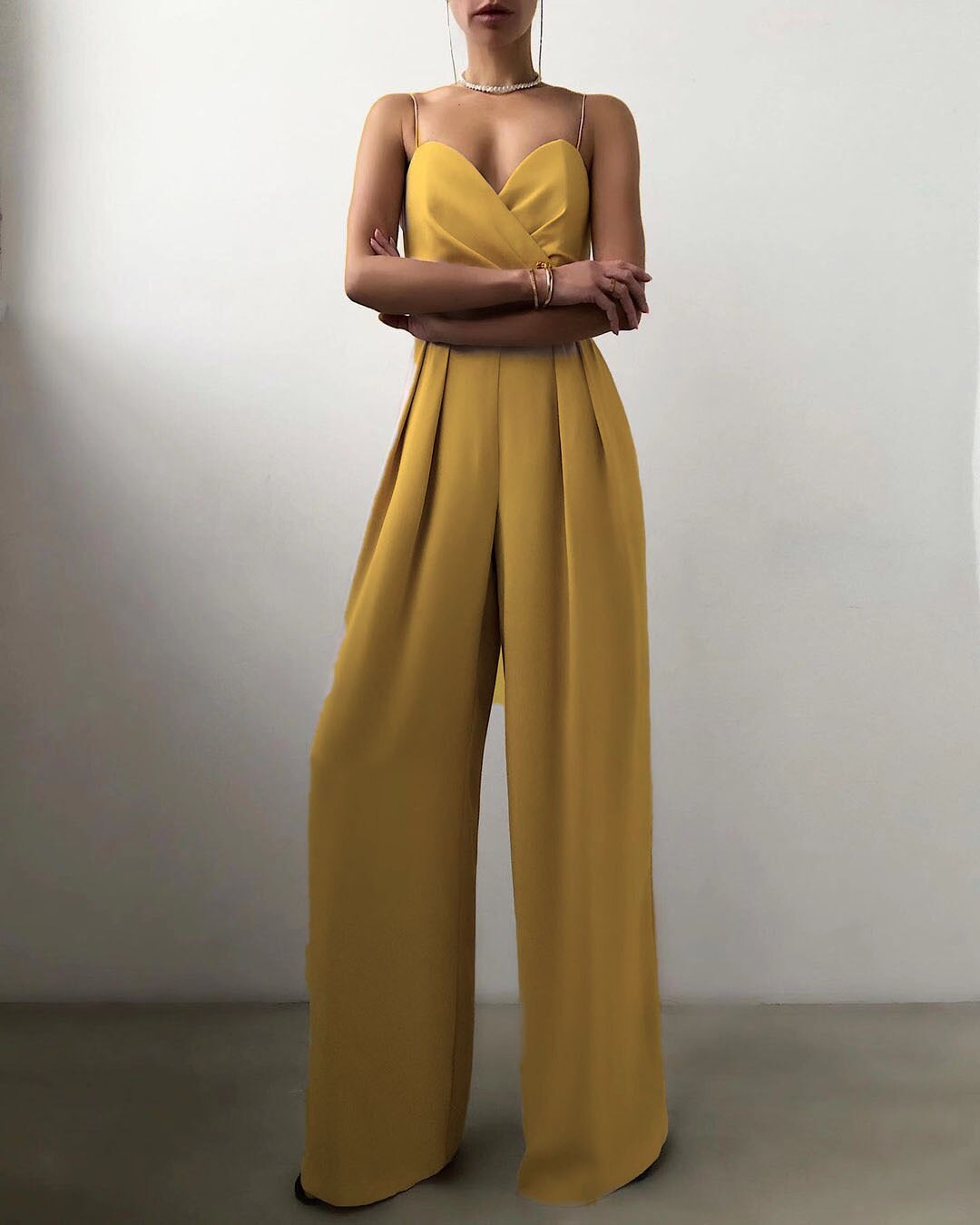 Mustard pleated wide leg jumpsuit with a sweetheart neckline