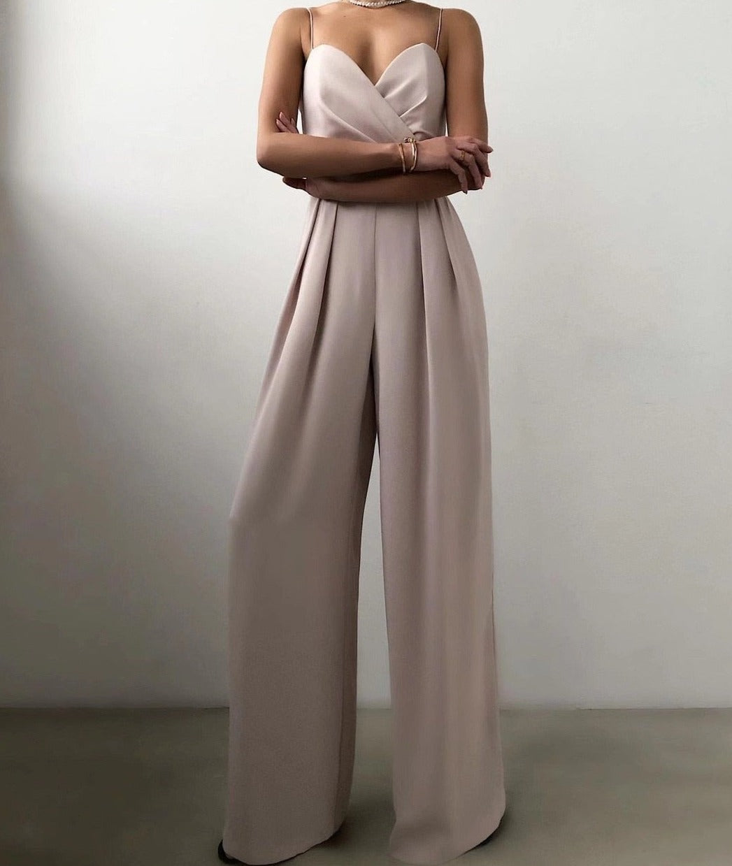 Nude wide leg jumpsuit with front pleats and thin straps