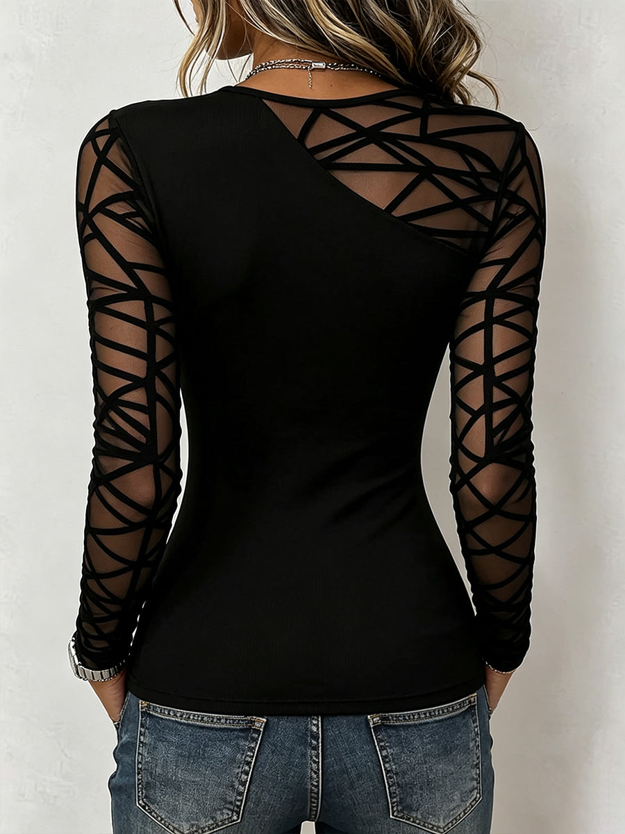 Back view of the black top with sheer mesh shoulder and sleeves