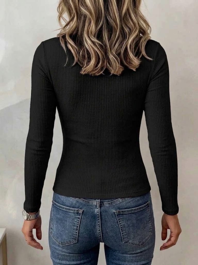 Back of the black ribbed top showing the plain, close fit