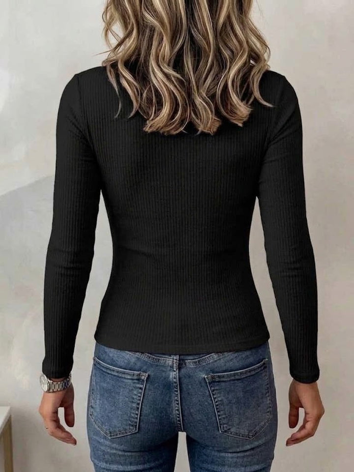 Back of the black ribbed top showing the plain, close fit