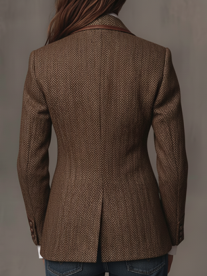 Back view of the brown herringbone blazer showing the center vent