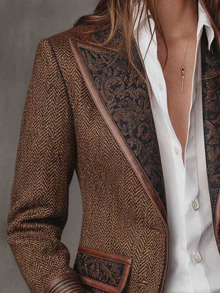 Close-up of the paisley panel lapel and flap pocket on the brown blazer