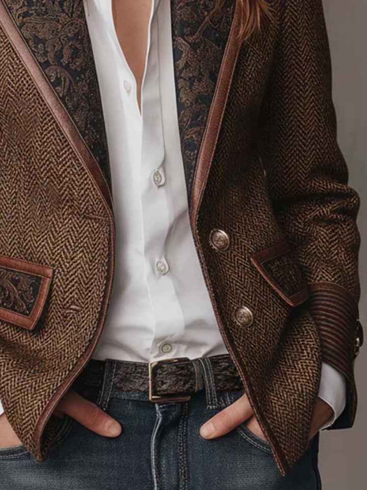 Detail of the belt, flap pocket and button front of the brown blazer