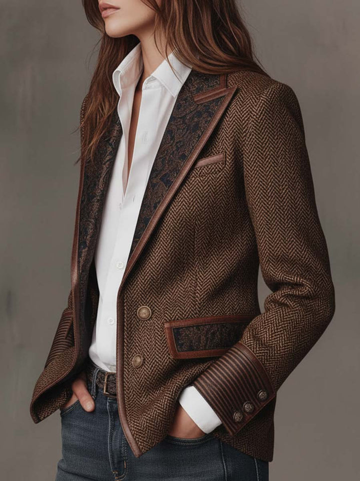 Three-quarter view of the herringbone blazer with paisley lapel and hands in pockets