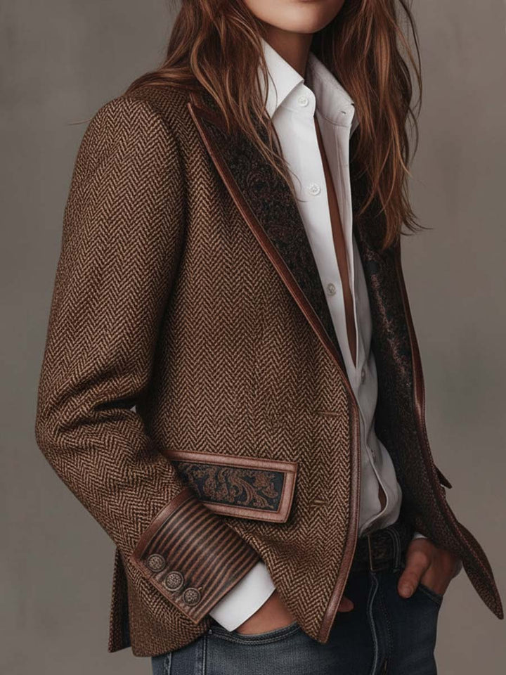 Brown blazer worn open with one hand in pocket over a white shirt