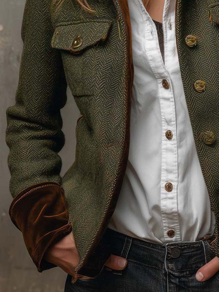 Detail of the blazer contrast cuff and patch pocket with jeans