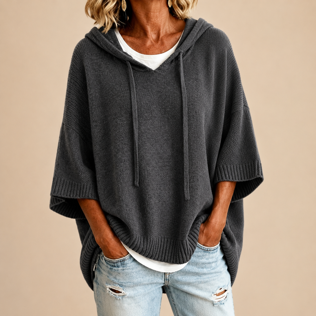 Charcoal hooded knit poncho with three quarter sleeves, front view