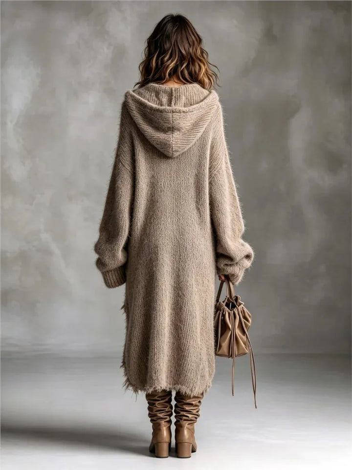Back view of the khaki sweater dress showing the hood and long oversized cut