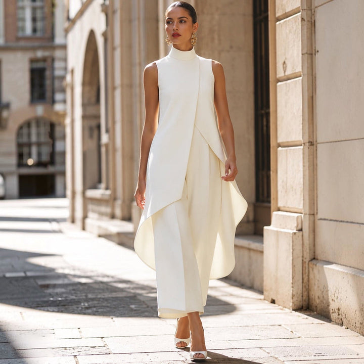 Ivory jumpsuit styled with strappy heels while walking down a sunlit street