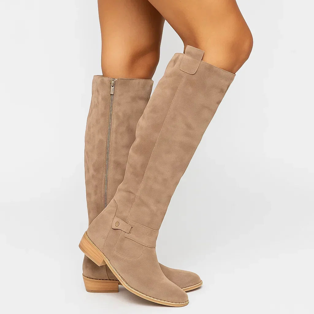 Women's beige knee high boots, worn on a model