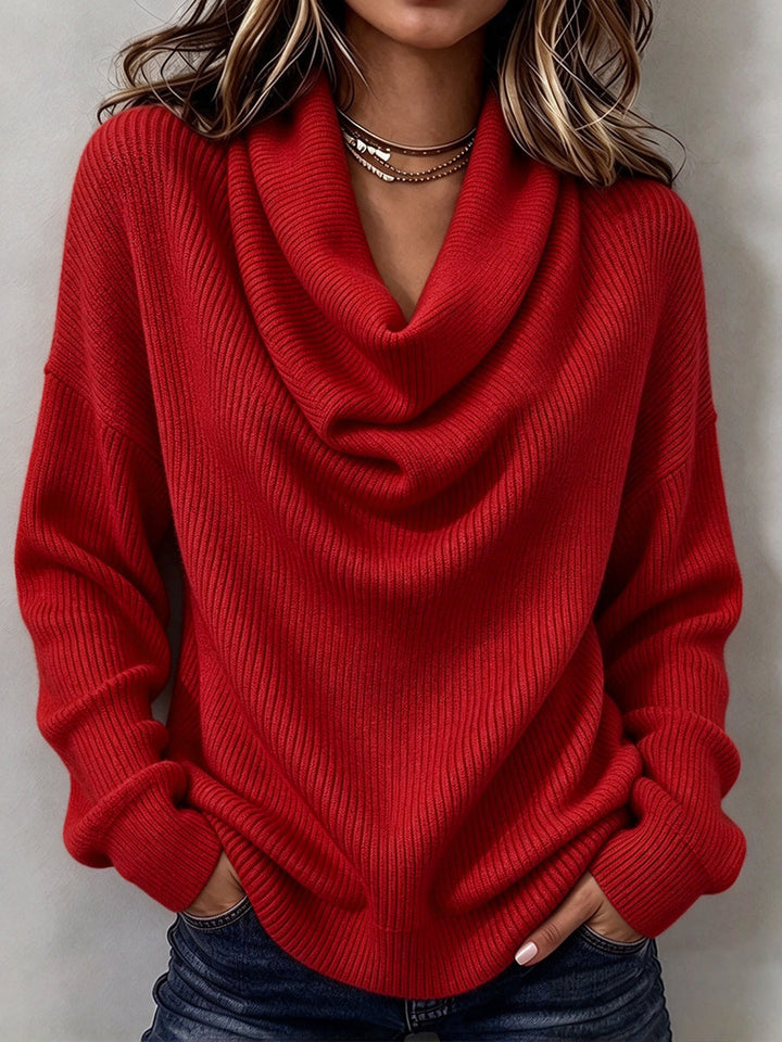 Red ribbed knit sweater with draped neckline and relaxed fit