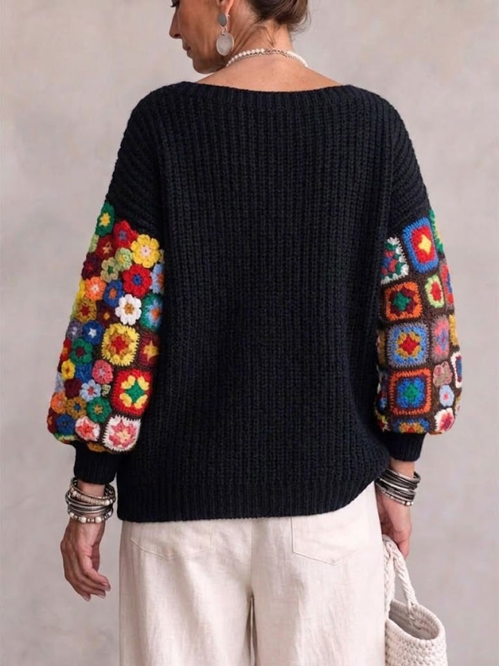 Back view of the ribbed sweater with floral crochet patches on both sleeves