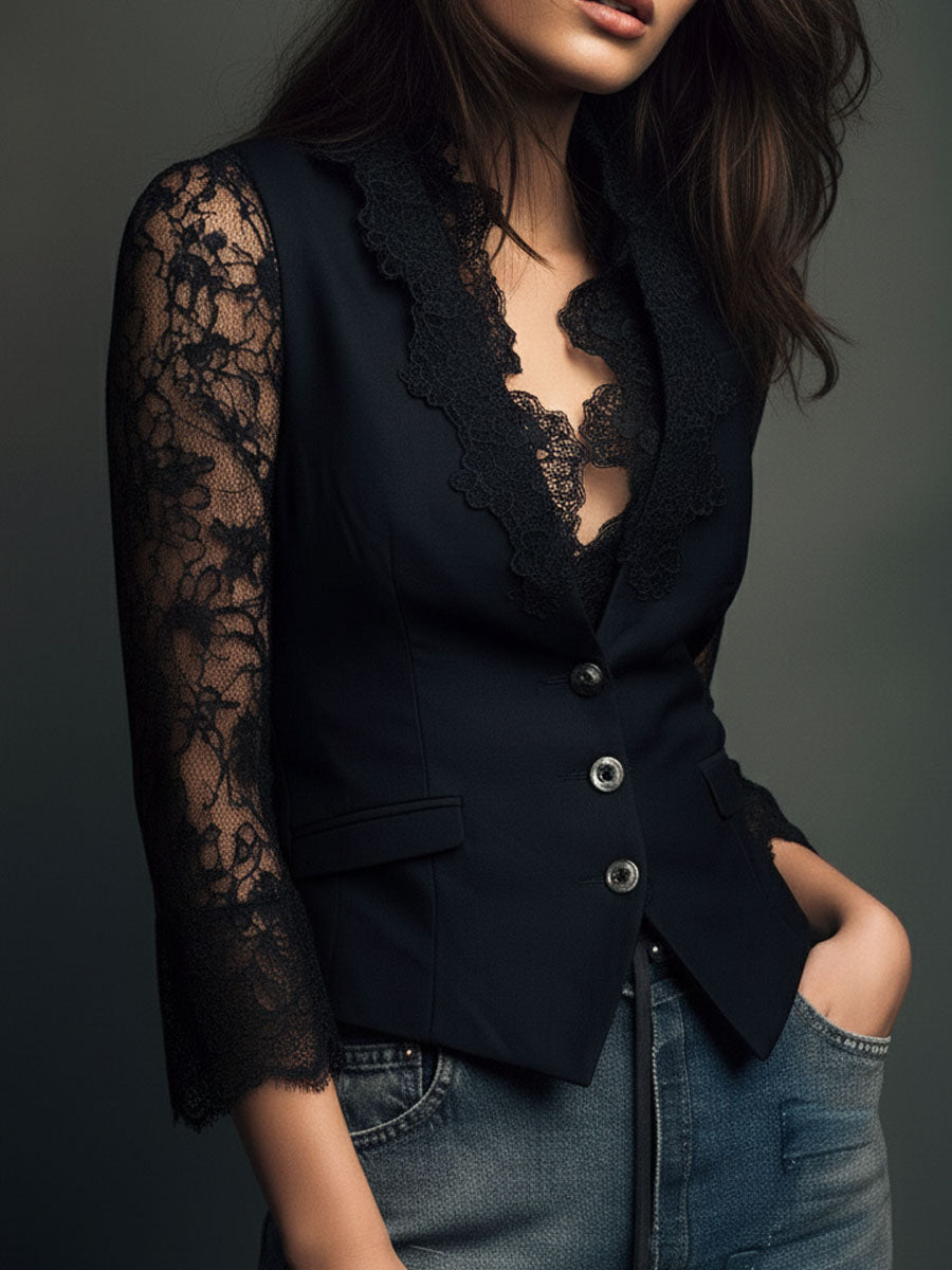 Black lace blazer with lace sleeves, slightly angled front view with hand in pocket