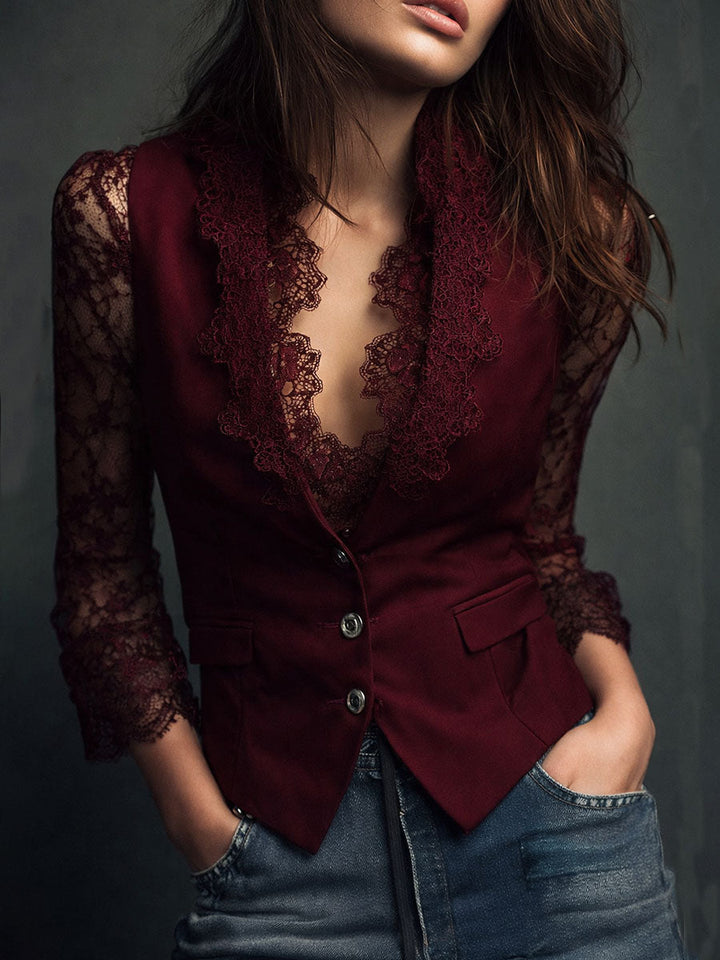 Burgundy lace blazer with lace collar and sleeves, front view with hands in jeans pockets