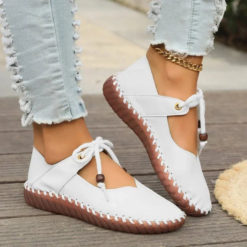 White lace up flats with bow tie and stitched sole
