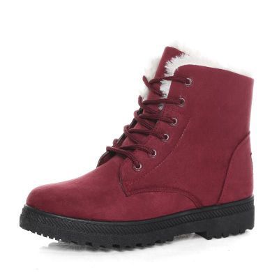 Burgundy winter ankle boot with dark laces and a chunky tread sole