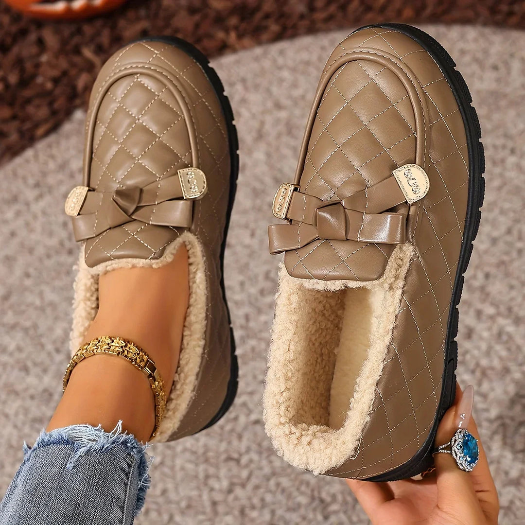 Close-up of the plush lining inside the coffee quilted loafer