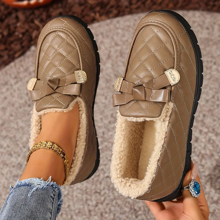 Close-up of the plush lining inside the coffee quilted loafer