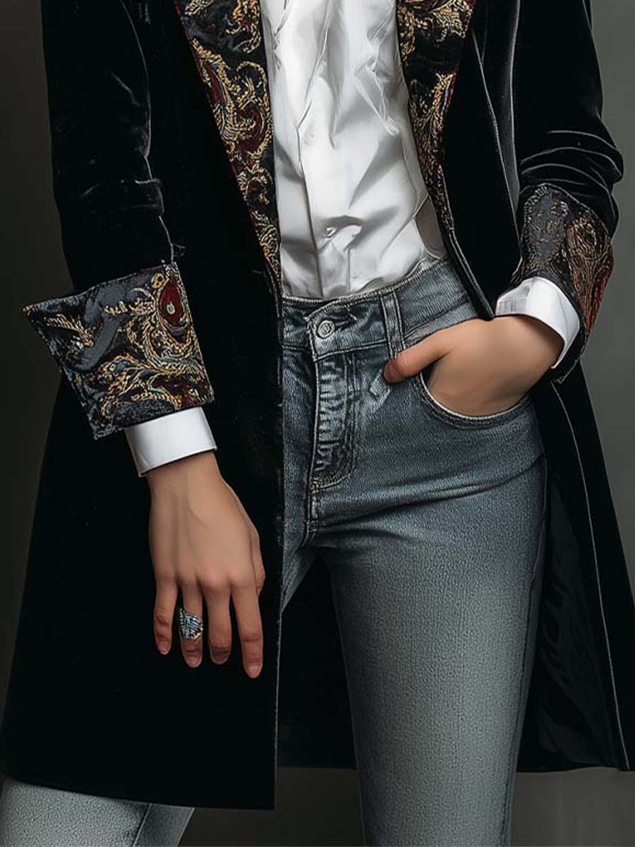 Paisley patterned cuff and hand-in-pocket detail on the black velvet-look long blazer