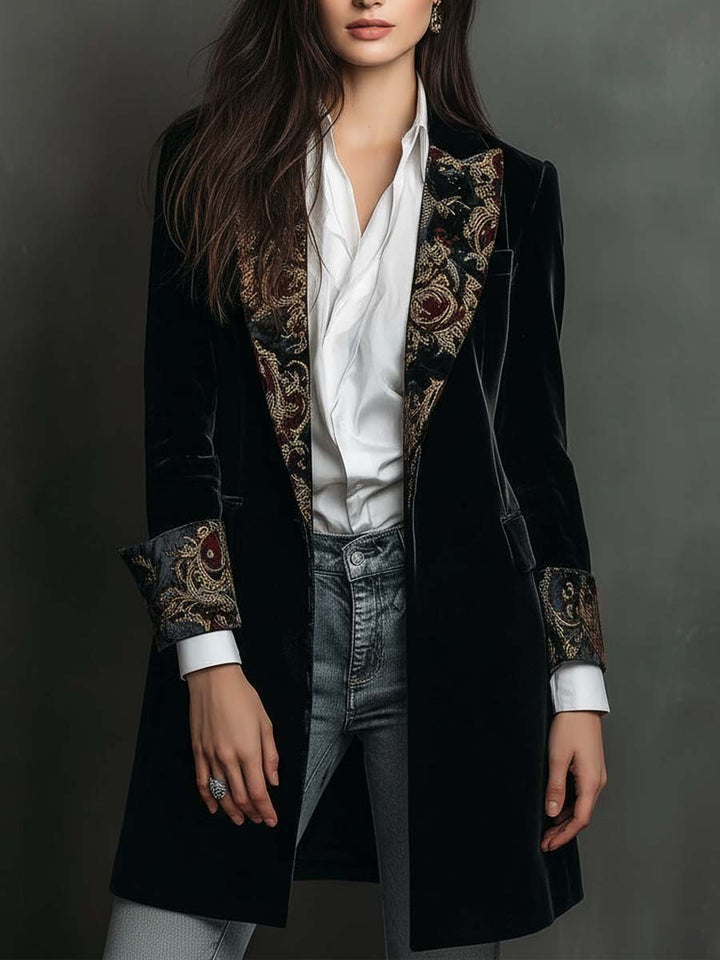 Black velvet-look long blazer front view worn open over a white shirt and jeans