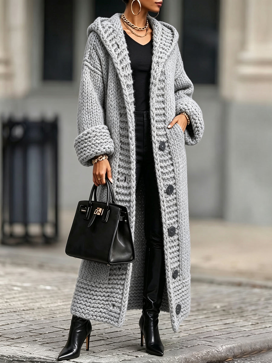 Light gray hooded long cardigan with hand in the side pocket