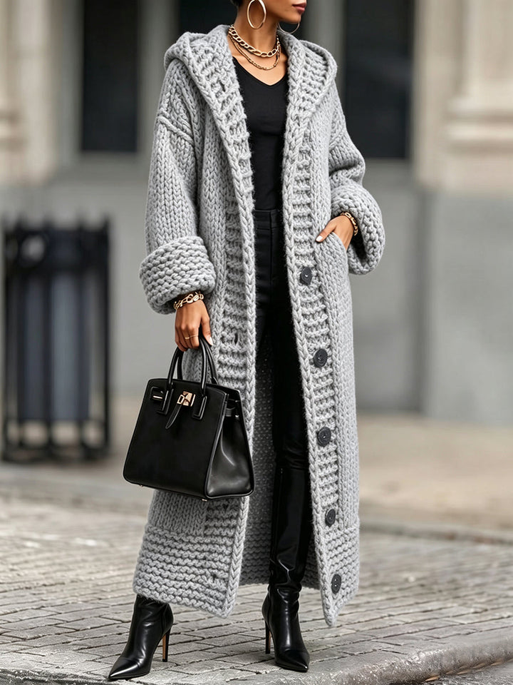 Light gray hooded long cardigan with hand in the side pocket