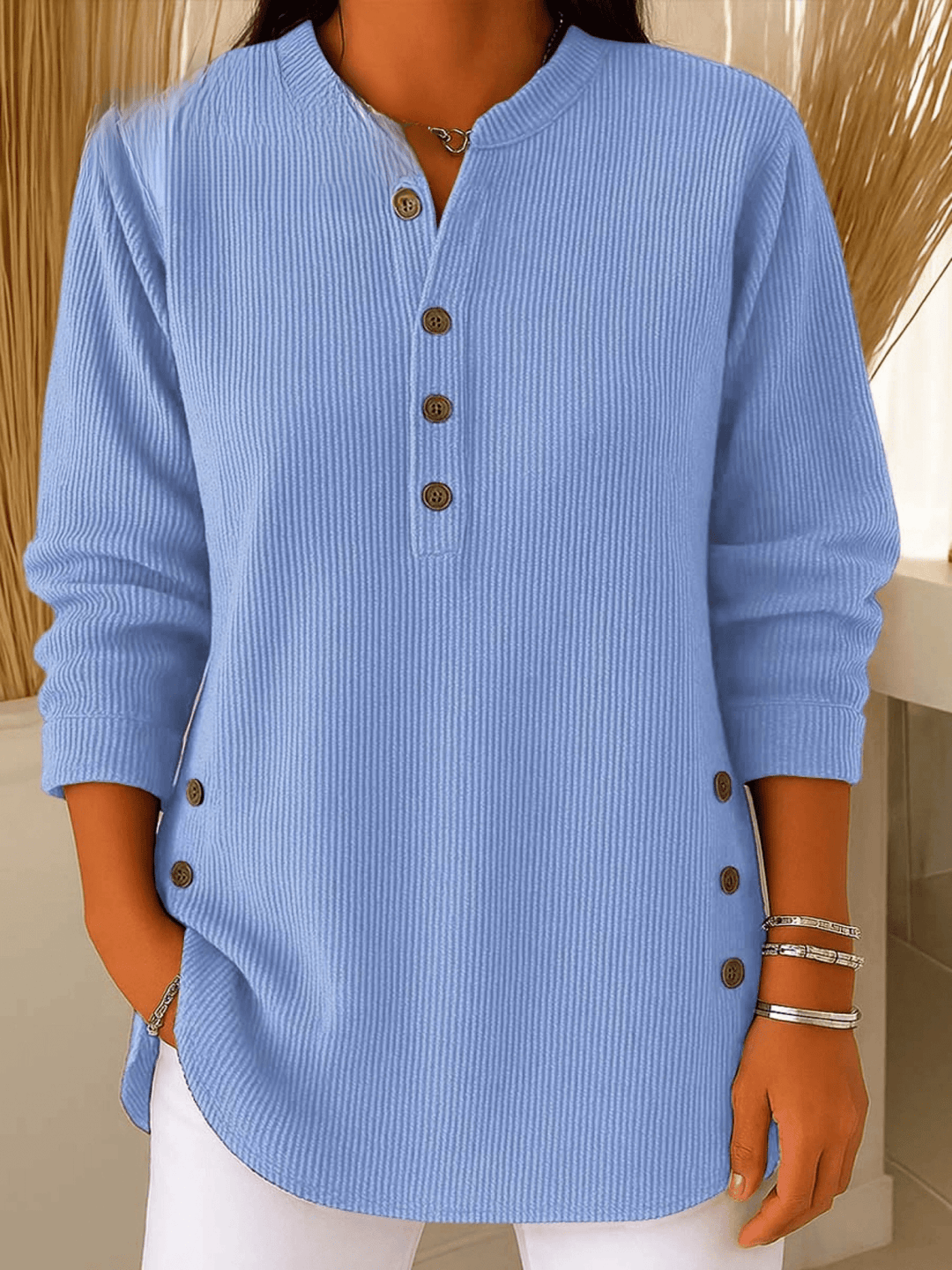 Women's light blue ribbed henley tunic sweater, front view on a model