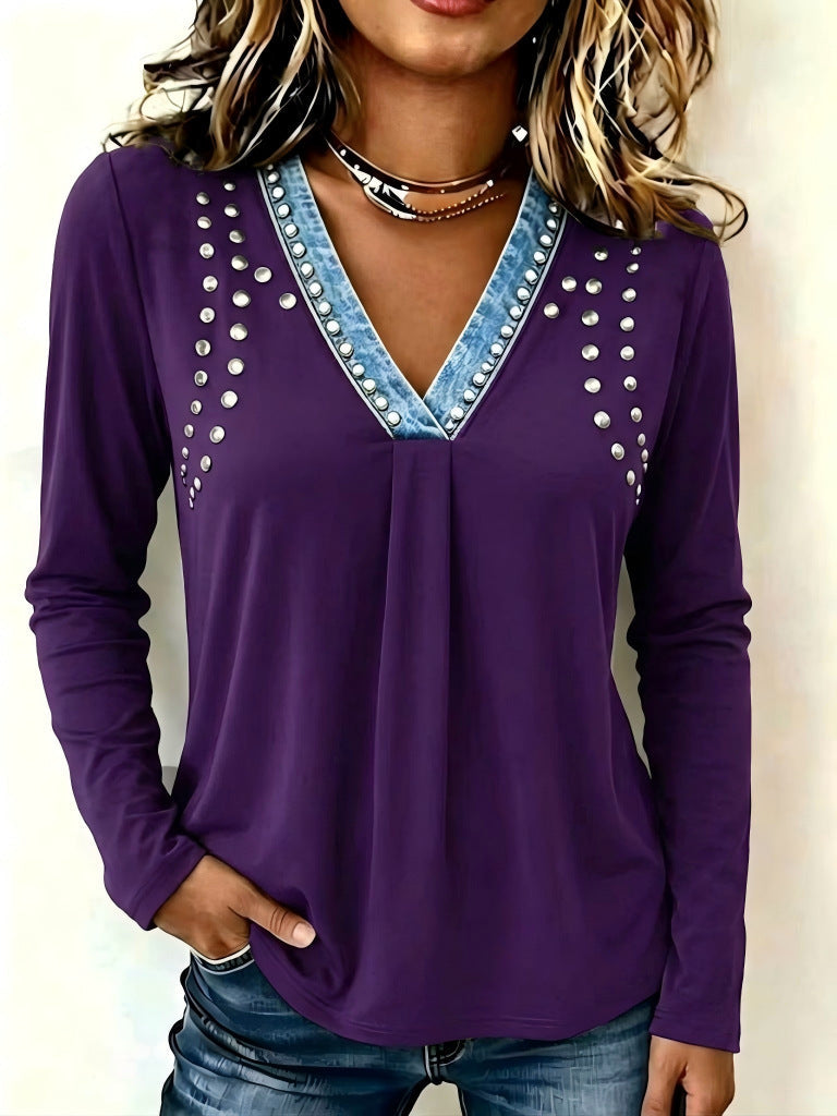 Purple V-neck top with silver-tone studs fanning across the chest