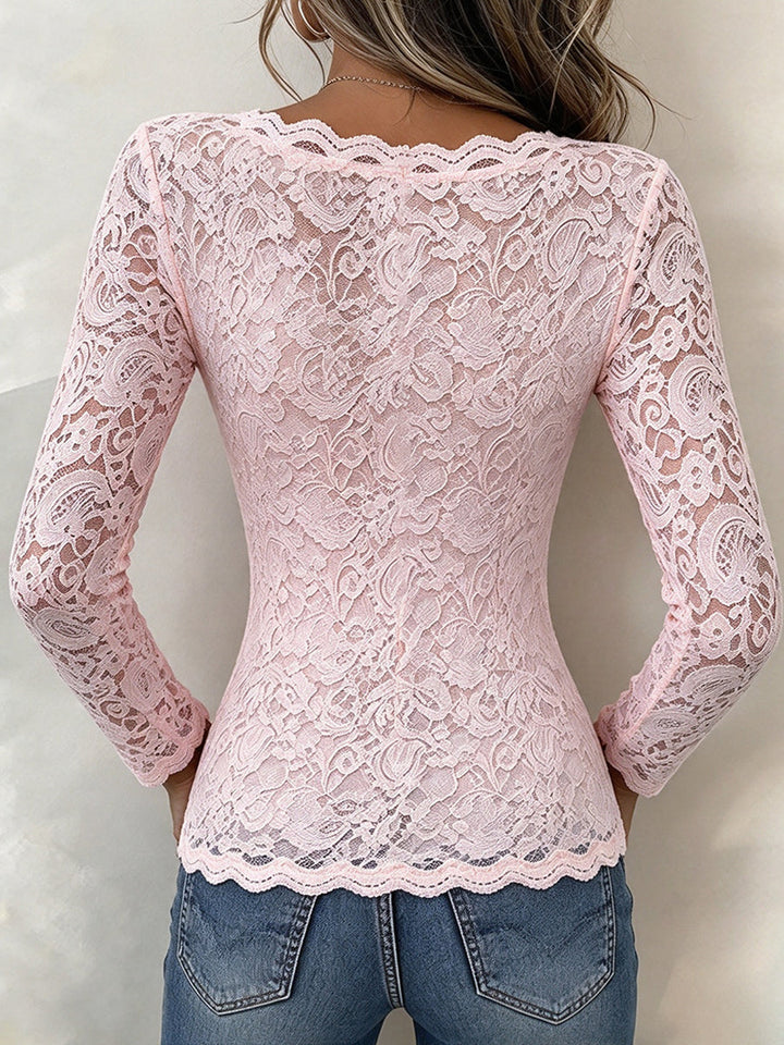 Back view of the pink lace top with scalloped hem