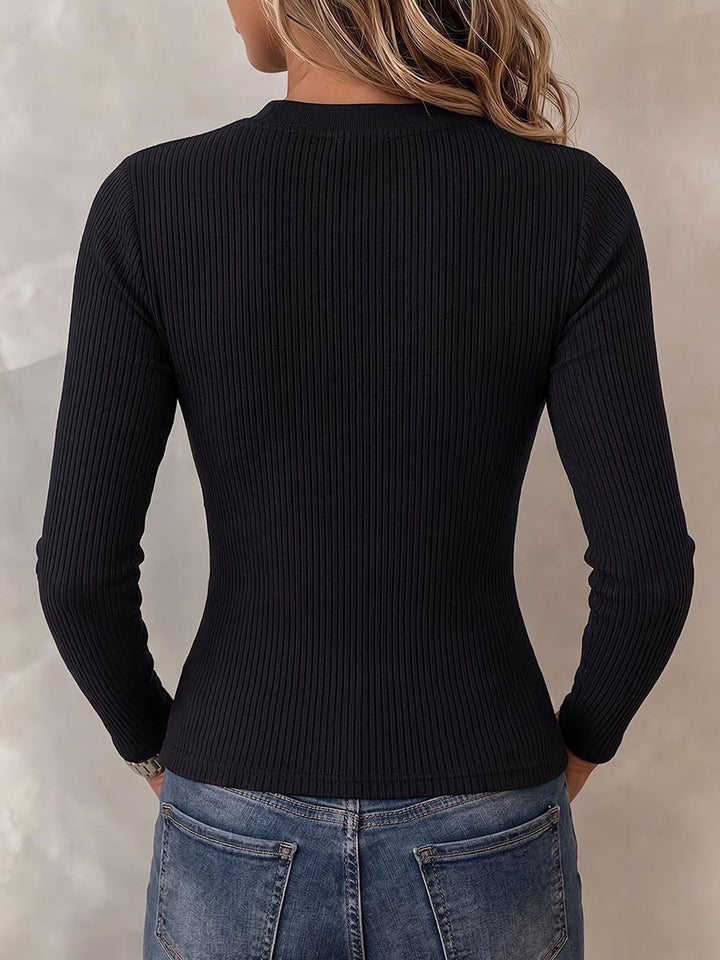 Back of the black ribbed top, plain and close fitting
