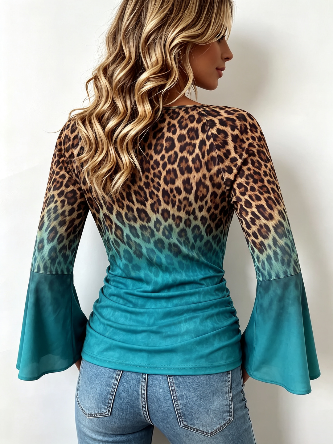 Back view of the leopard to teal gradient and flared sleeves