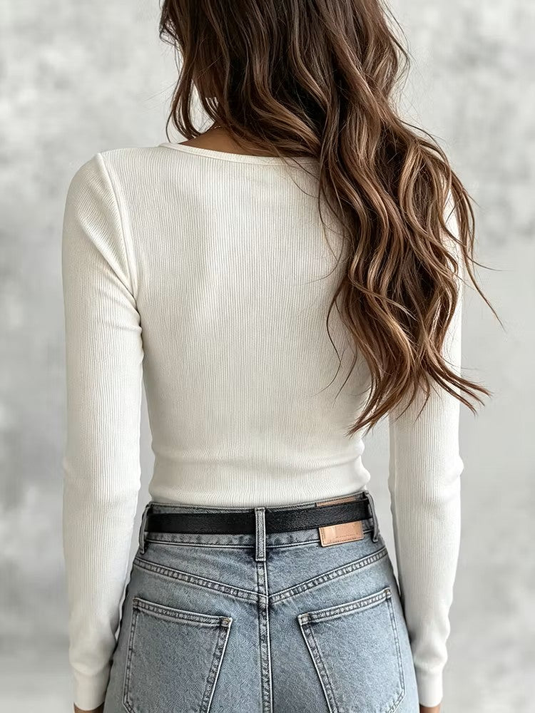 Back view of the white ribbed top showing the clean slim fit