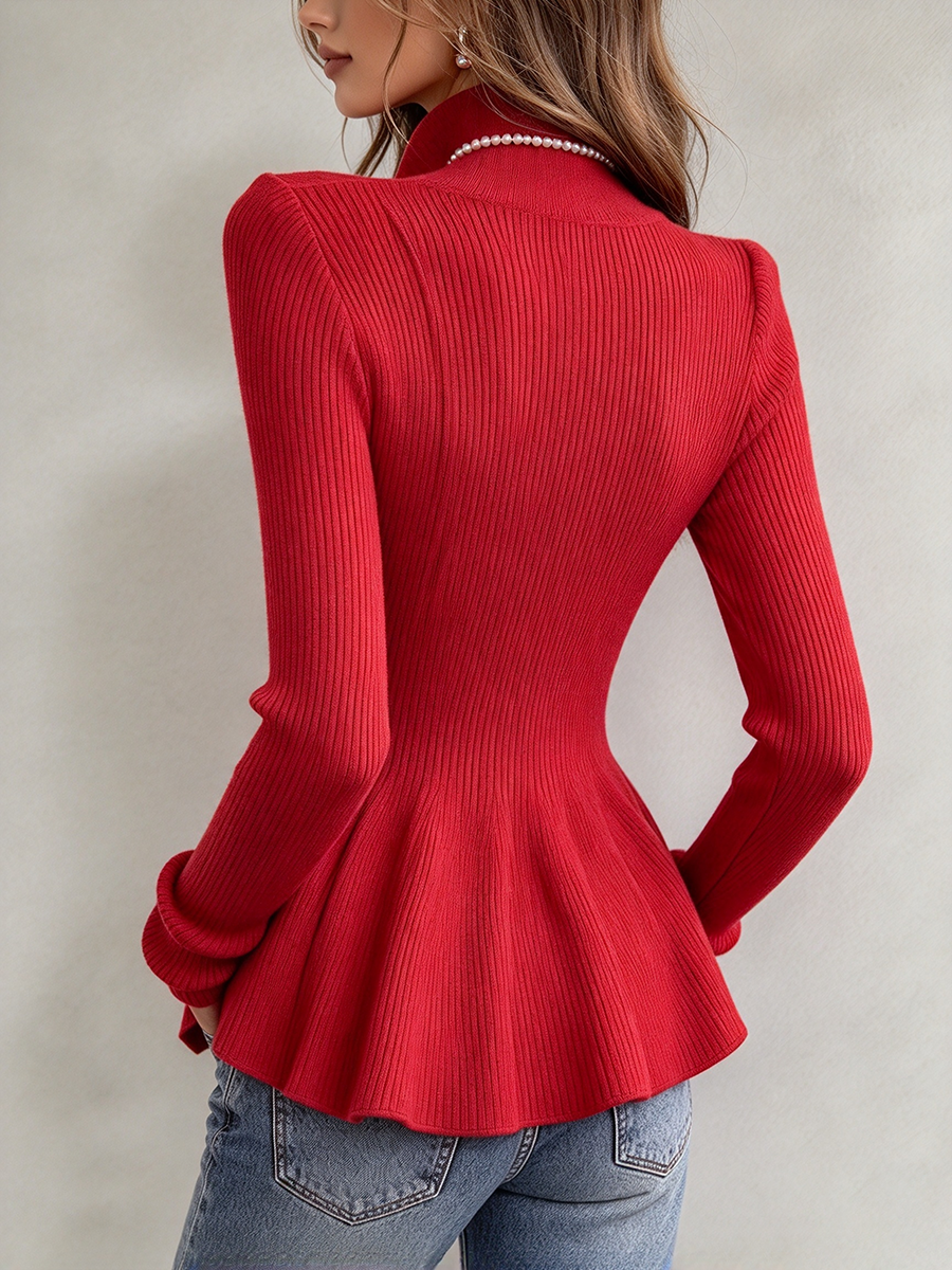 Back view of the red top showing the fitted waist and flared peplum