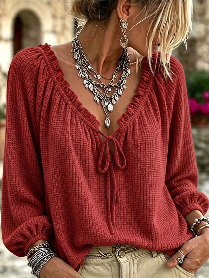 Brick red waffle knit top with puffed cuffs