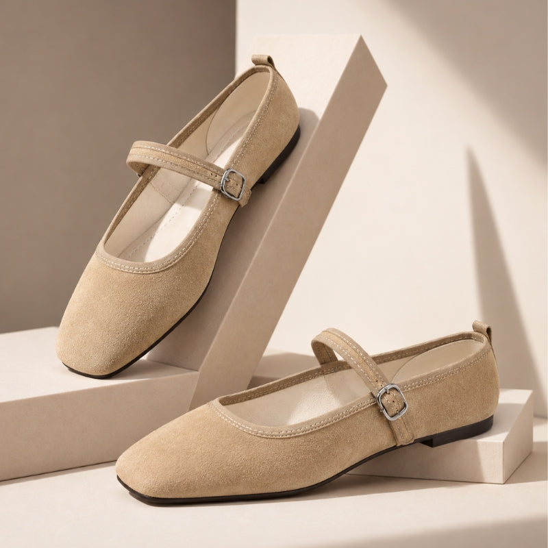 Beige square toe Mary Jane flats with thin buckle strap, pair on display