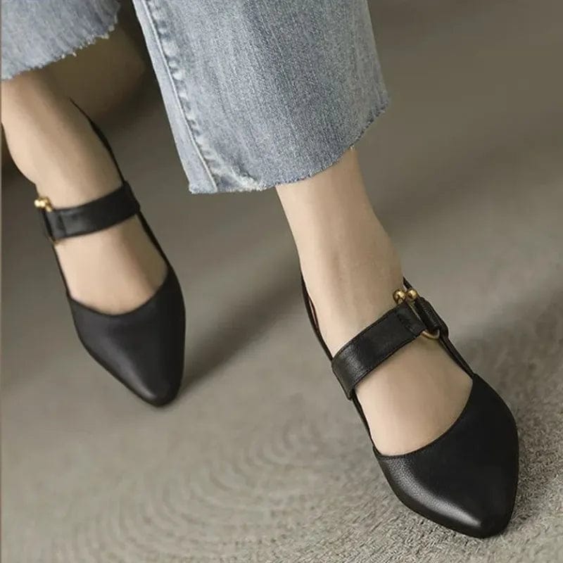 Black pointed toe Mary Jane heels with ankle strap worn with jeans