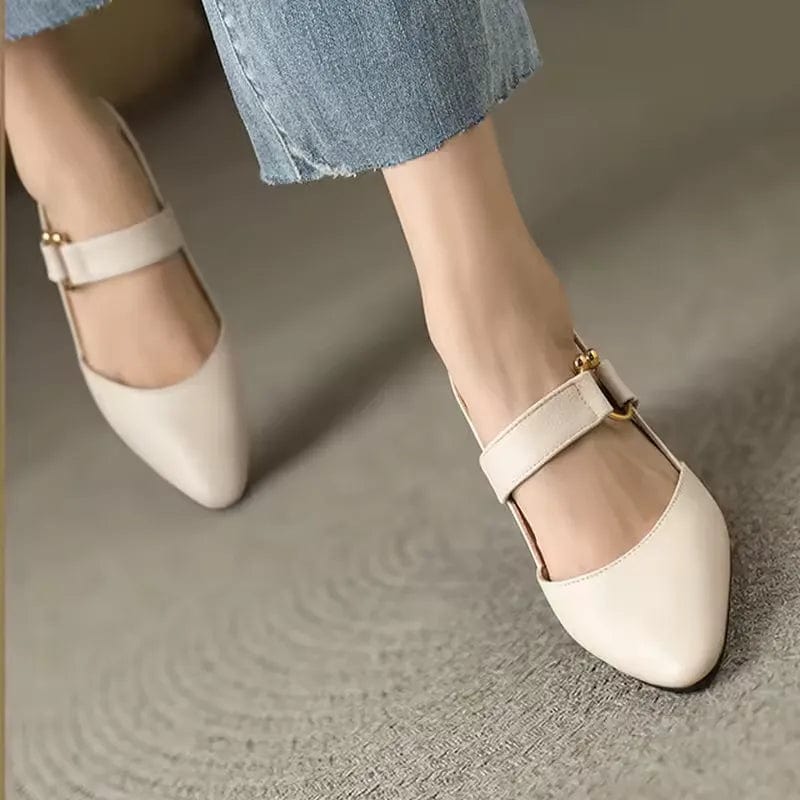 Cream pointed toe Mary Jane block heels with buckle strap worn with jeans