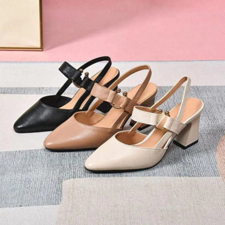 Black, nude and cream slingback block heel pumps shown together