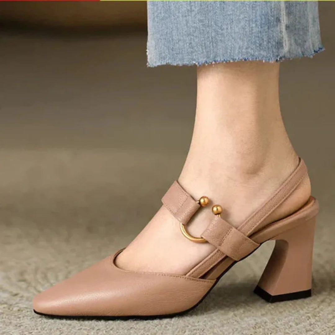 Nude Mary Jane slingback block heel pump with gold buckle, worn side view