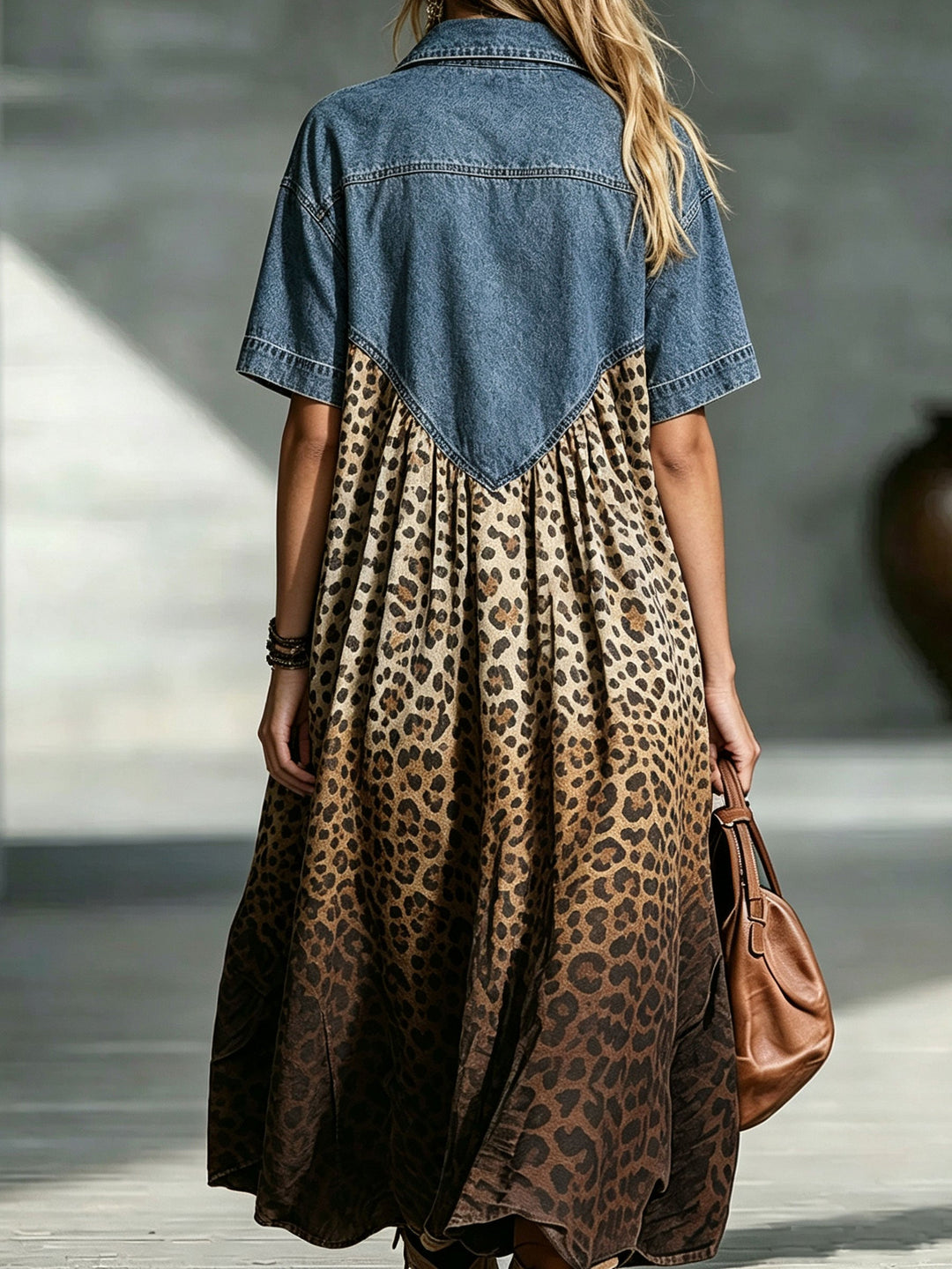 Back view of the maxi dress with V-shaped yoke and gathered skirt