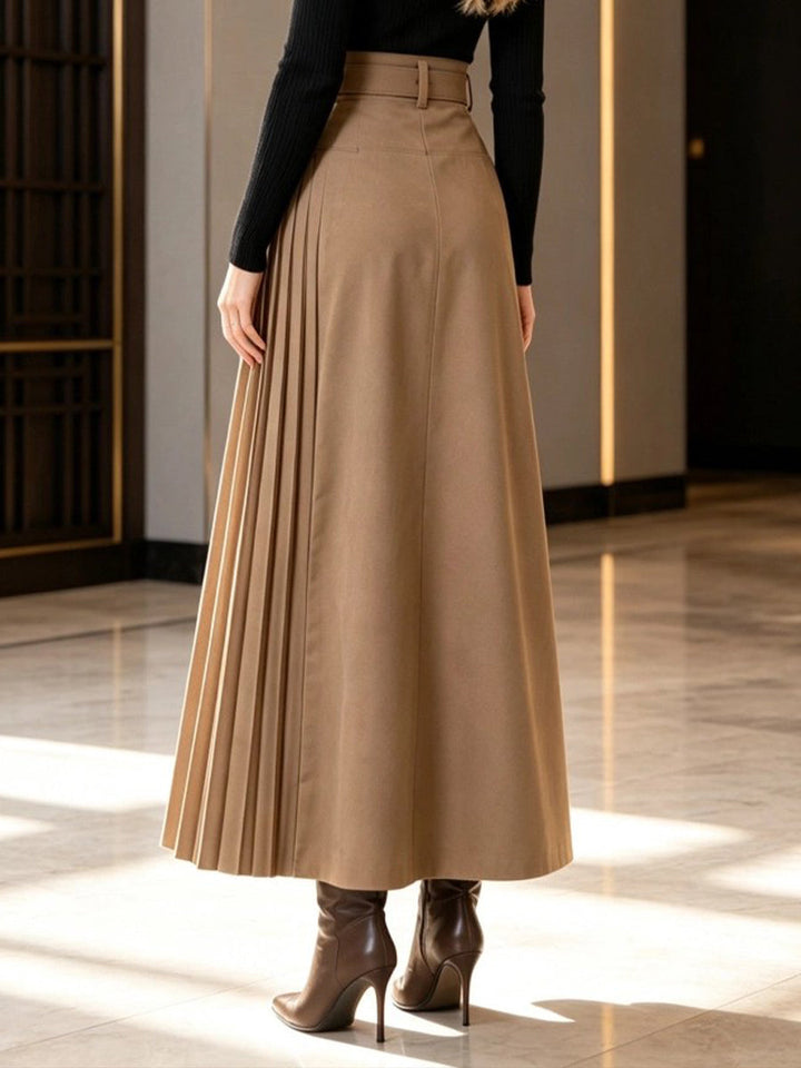Back of the camel belted skirt with pleats sweeping to the hem