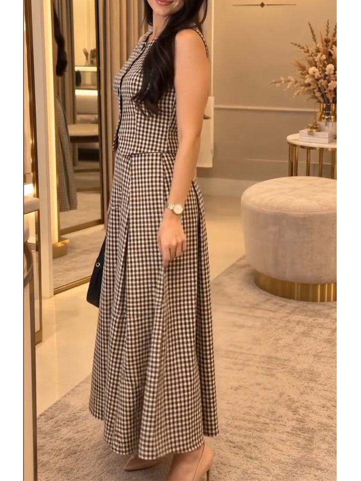 Side view of the gingham vest and ankle-length pleated skirt